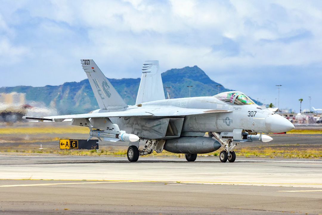 F/A-18E Super Hornet with an AIM-174B missile. Diamond Head Hawaii is in the background.