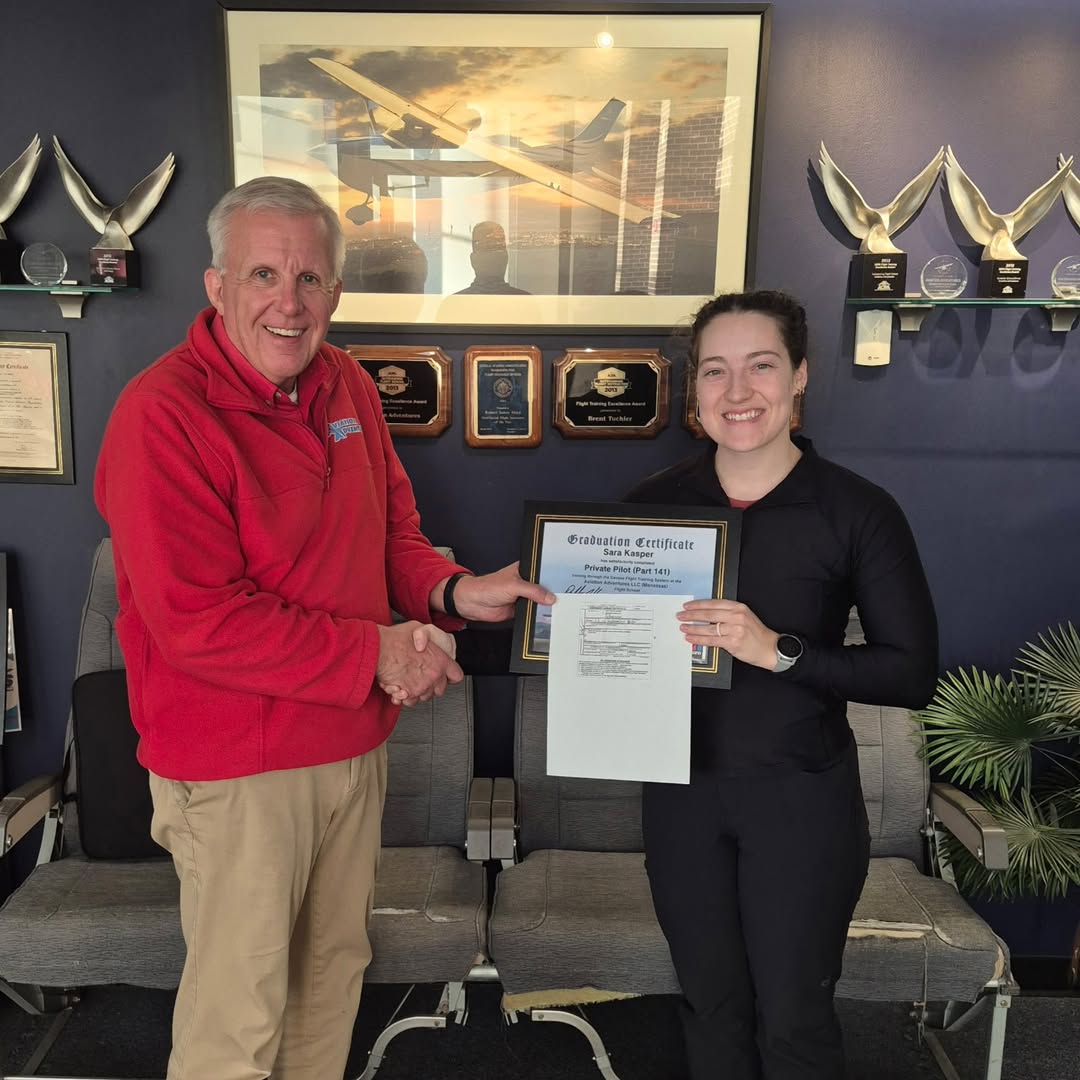 A student getting her graduation certificate.